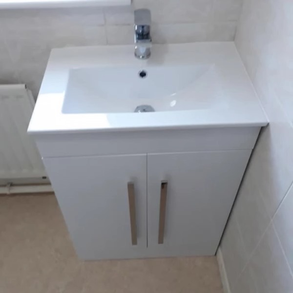 New white vanity unit with basin and chrome tap